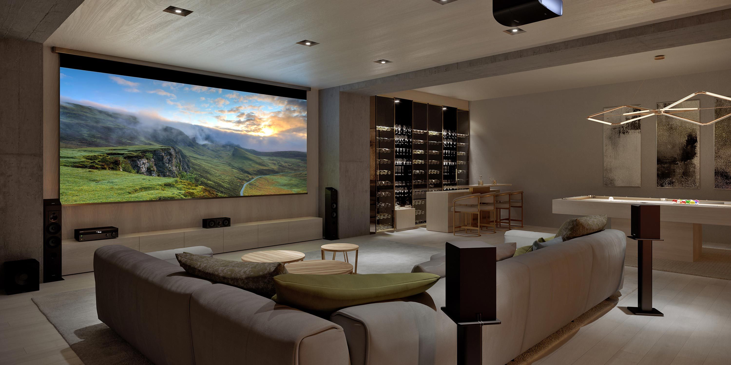 A modern entertainment room featuring a large projection screen, a seating area, and a wine display.